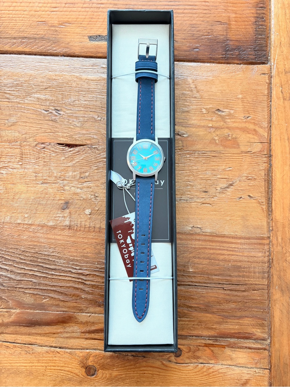 TOKYObay Blue Strap Watch with Turquoise Dial and Orange Accents